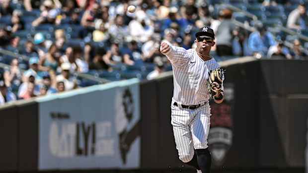 Jul 23, 2023; Bronx, New York, USA; New York Yankees third baseman Oswald Peraza (91) fields a ground ball and throws to first base for an out against the Kansas City Royals during the fourth inning at Yankee Stadium.
